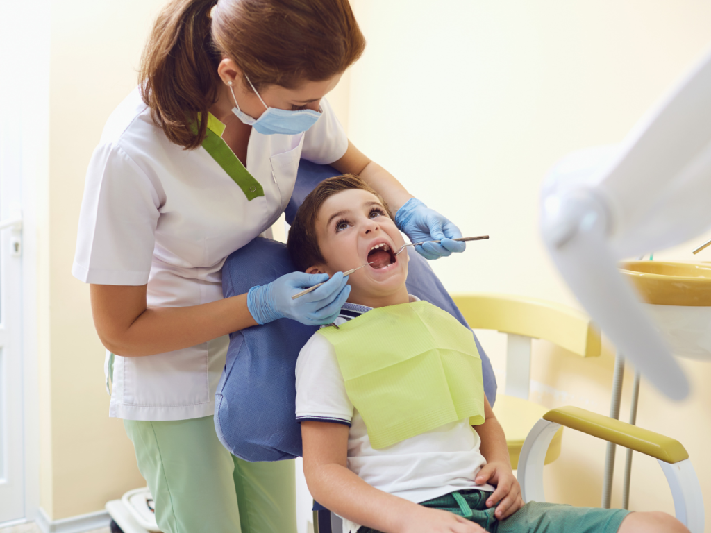 Dentist examining a child during a routine dental check-up at the Best Dental Clinic in Jayanagar